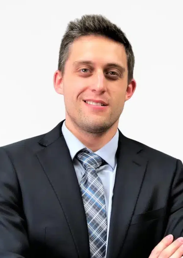 Lawyer Matt Ryder wearing a black suit, Portrait style