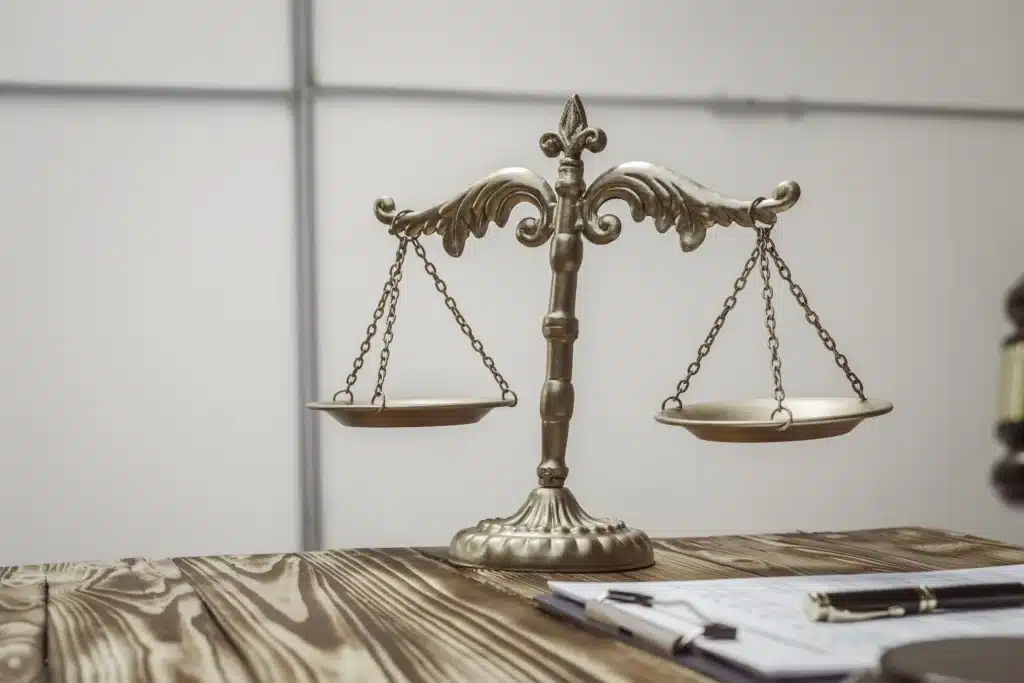 A businessman in a formal suit signs a contract, hands close up, suggesting possible bribery