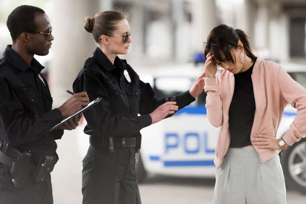 police officer consoling woman