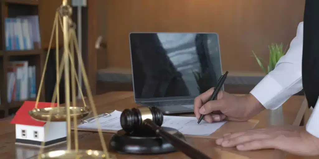 Close up lawyer businessman working or reading lawbook in office workplace for consultant lawyer