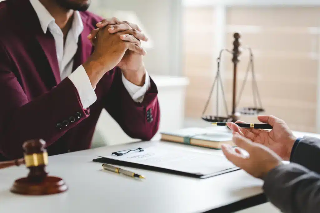 A male judge in the courtroom on a wooden table