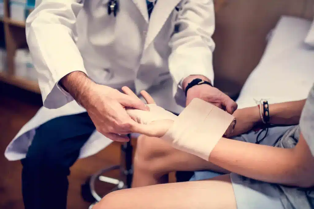 "Doctor assisting a patient "