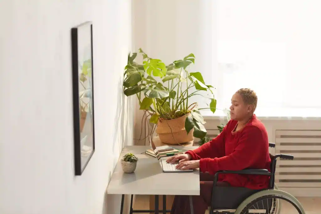 Female Wheelchair User Working from Home
