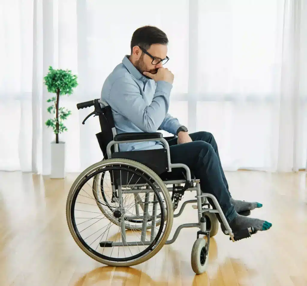 Lonely depressed sad and worried young man in wheelchair