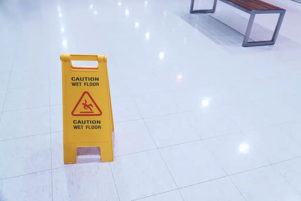 Yellow Sign showing warning of caution wet floor