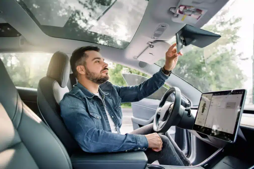 Man Wearing Casual Jeans Shirt, Sitting In His New Electric Autonomous